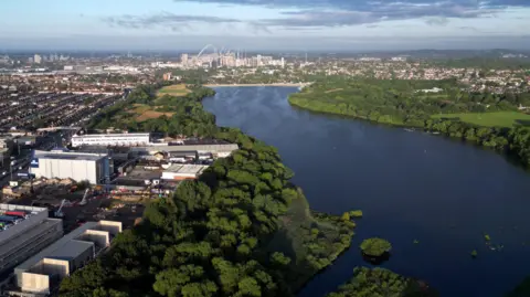 Getty Images An aerial photo of a reservoir in an urban landscape with Wembley Stadium visible in the distance. 