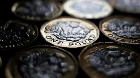 BBC Pound coins stacked on top of each other