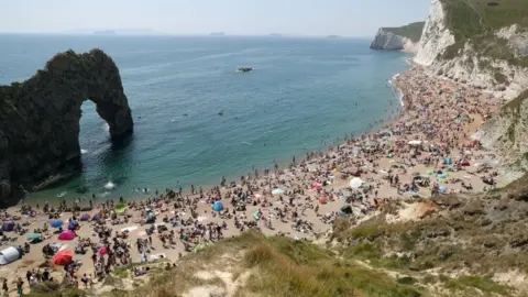 PA Media Earlier in the day crowds of people flocked to the popular beauty spot