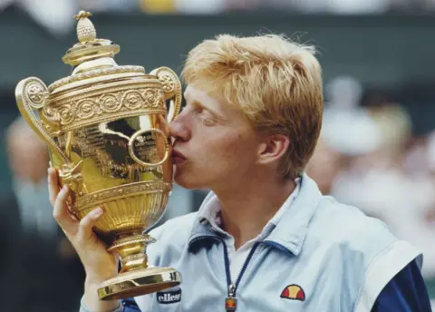 Steve Powell/Allsport/Getty Images Boris Becker with the Wimbledon trophy in 1985