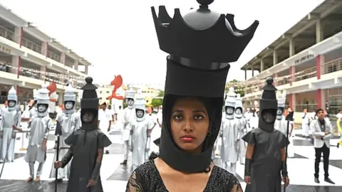 Getty Images Children dressed as chess pieces perform during an event organised ahead of the 44th Chess Olympiad 2022, in Chennai on 26 July