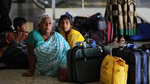 Getty Images Sri Lankan refugees arrive home after returning from India in Katunayake in 2015.