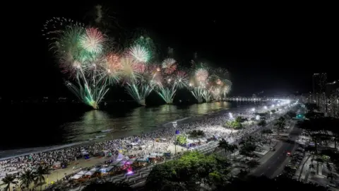 Reuters Fireworks fill the sky over Copacabana beach, in Rio de Janeiro