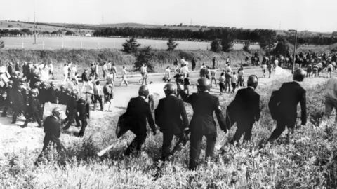 PA Media Riot police and miners in Orgreave
