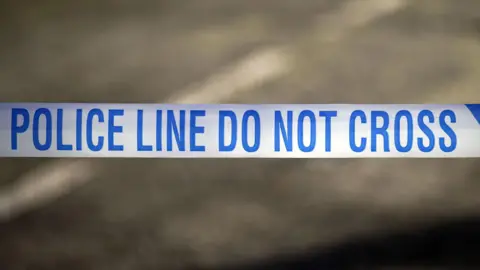 Stock image of police tape.