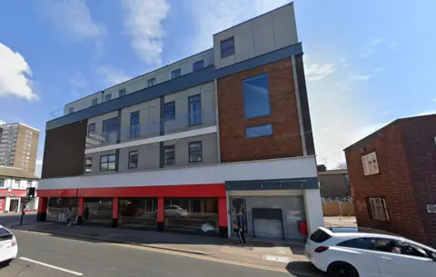 Google The building on the corner of Chichester Road and Southchurch Road in Southend-on-Sea. The bottom floor of the building is a restaurant with a white and red facade, and the upper floors are residential flats.