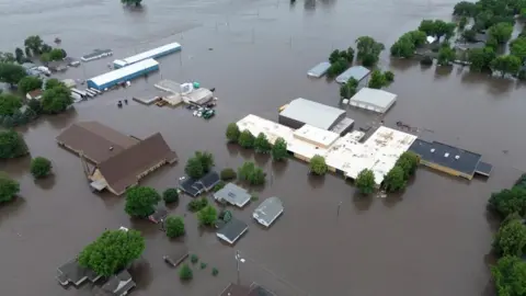 A drone view shows a flooded area following heavy rainfall in Rock Valley, Iowa, U.S. June 22, 2024, in this still image obtained from a social media video.