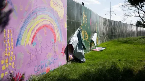 Getty Images A landscape of a perimeter screen which encircled Brockwell Park during the festival period.