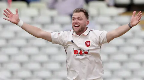 Sam Cook appeals during a game for Essex