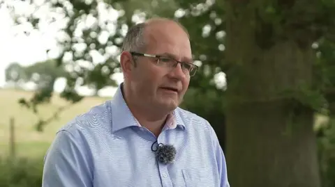NFU President Tom Bradshaw at his farm in Essex, being interview by the BBC