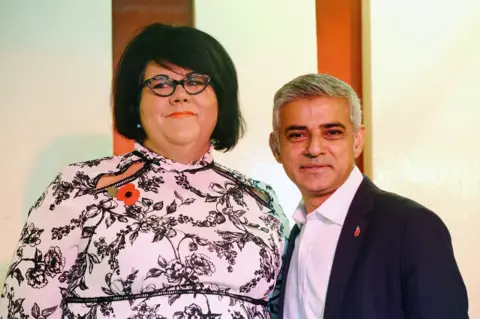 PA Amy Lamé and Sadiq Khan smile to camera