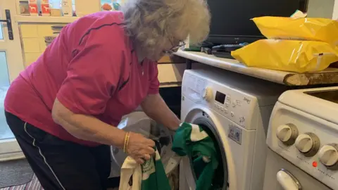 Waunarlwydd Football Club Margaret doing washing