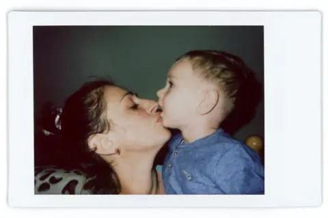 Jadwiga Bronte A polaroid photo of Alina and her son