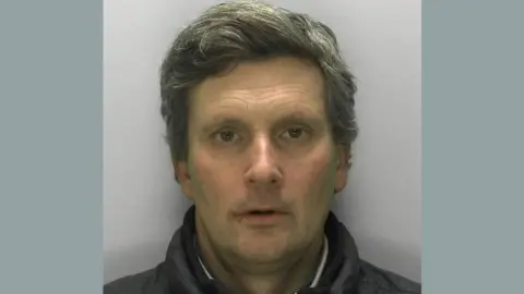 Gloucestershire Police Patrick Learmount looking at the camera for a custody mugshot
