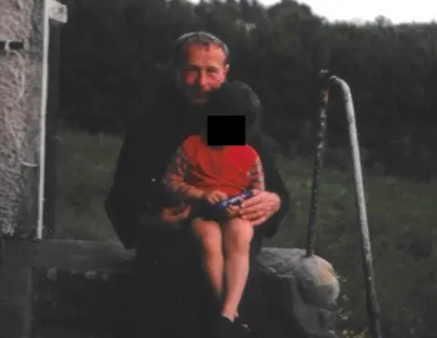 BBC Thaddeus Kotik with child