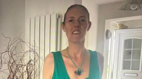 Rachael Johnson Rachael Johnson, with her hair tied tightly back at the time she was diagnosed with bowel cancer. She is wearing a green dress and a necklace with a green heart. She is smiling and looks to have lost a lot of weight.