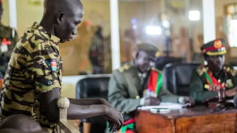 Getty Images A South Sudanese soldier listens his verdict at the military court in Juba, South Sudan, on September 6, 2018