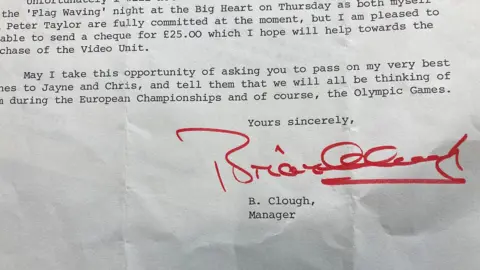 The photo shows part of a letter written by the then Nottingham Forest football manager Brian Clough. He has signed the letter and says he's sending a cheque for £25 to help buy video equipment for Torvill and Dean.