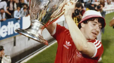 John Robertson lifts the European Cup