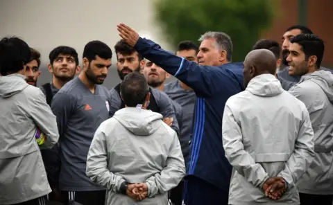 Getty Images Iran's Portuguese coach Carlos Queiroz gestures as he talks to his players a training session in Bakovka outside Moscow on June 12, 2018, ahead of the Russia 2018 World Cup tournament.