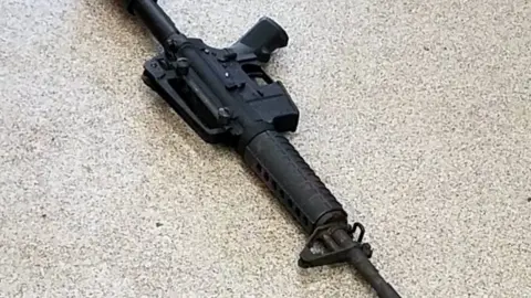 EPA A handout photo by the Metro Nashville Police Department shows the AR-15 style rife used by the gunman