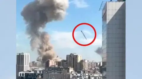 Twitter/XA Still from a video showing the moment before a missile hits a children's hospital in Kyiv