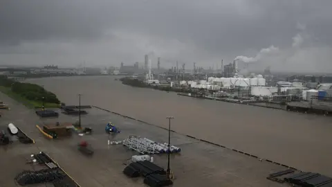 AFP/Getty The refinery section of the Houston Ship Channel is seen as flood water rise on August 27, 2017 as Houston battles with tropical storm Harvey and resulting floods.