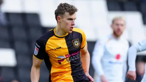 Sven Sprangler looks to his right during a match for Newport County