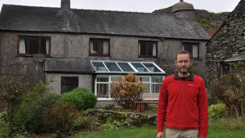 Mike Hooper Mike Hooper outside his house