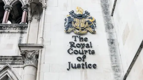 Getty Images Exterior close up sign on the wall of the Royal Courts of Justice in London