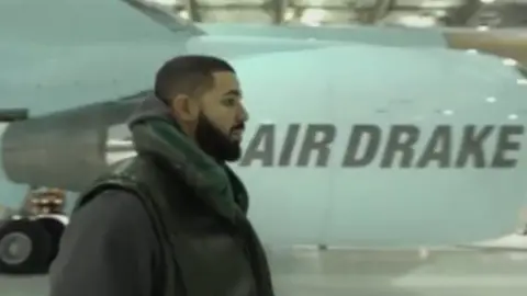 Instagram/champagnepapi drake near his jet