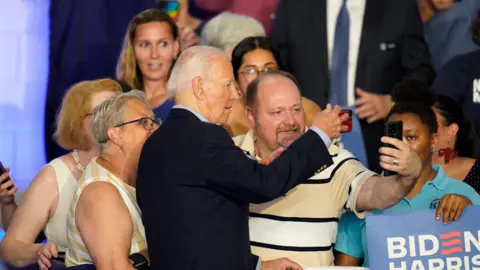 EPA President Biden poses for a selfie with supporters in Wisconsin