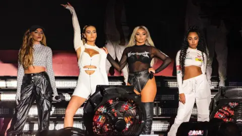 Getty Images Jade Thirlwall, Perrie Edwards, Jesy Nelson and Leigh-Anne Pinnock of Little Mix perform on stage.