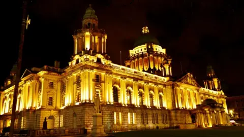 PAcemaker Belfast City Hall lit up in remembrance for those who have died during the Covid-19 pandemic