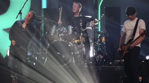 Getty Images Dave Rowntree drumming in Blur