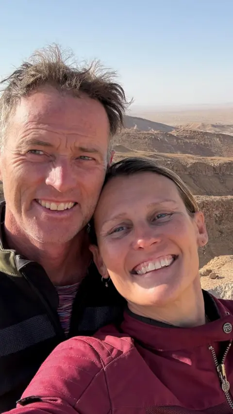 Two people smiling in a selfie.