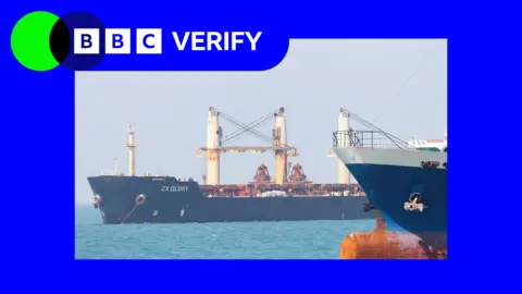 Two ships with dark-coloured hulls in the Strait of Hormuz