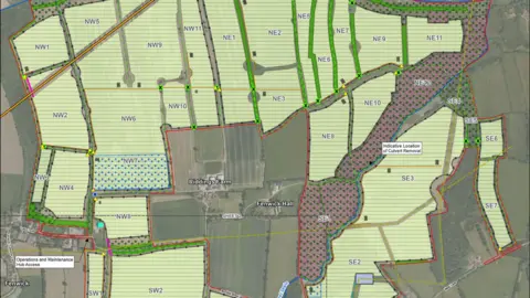 Boom Power An aerial shot high about several fields