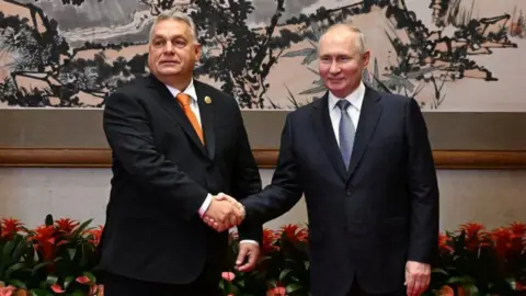 Reuters Hungarian Prime Minister Viktor Orban (left) and Russian President Vladimir Putin shake hands in Beijing, China. Photo: 17 October 2023