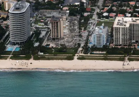 Getty Images In this aerial view, search and rescue personnel work after the partial collapse of the 12-story Champlain Towers South condo building on June 24, 2021 in Surfside, Florida.