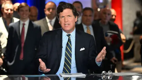 Getty Images Tucker Carlson speaks during 2022 FOX Nation Patriot Awards at Hard Rock Live at Seminole Hard Rock Hotel & Casino Hollywood on November 17, 2022 in Hollywood, Florida