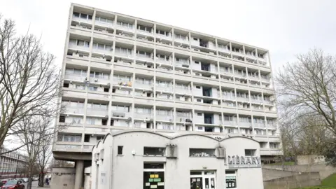 An exterior view of a block of flats on the estate. 
