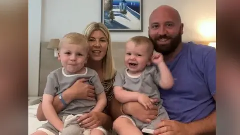 Family photo Joey (left) and Louie (right) with mum Ashleigh and Dad Dean