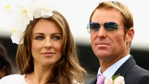 Getty Images Elizabeth Hurley and Shane Warne in 2011