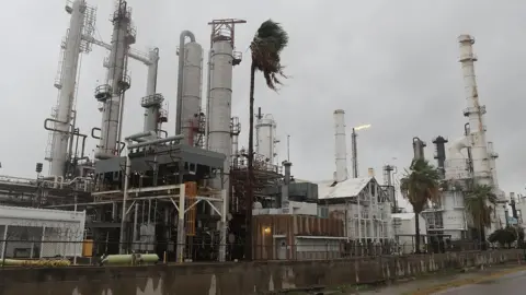 AFP/Getty An oil refinery is seen before the arrival of Hurricane Harvey on August 25, 2017 in Corpus Christi, Texas. As Hurricane Harvey comes ashore many of the countries oil refineries are in its path and have had to shut down.