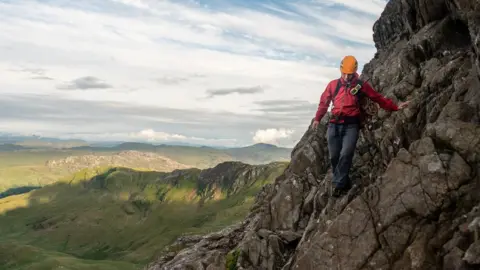 Llanberis Mountain Rescue Llanberis Mountain Rescue Team member descending Crib Goch following a rescue