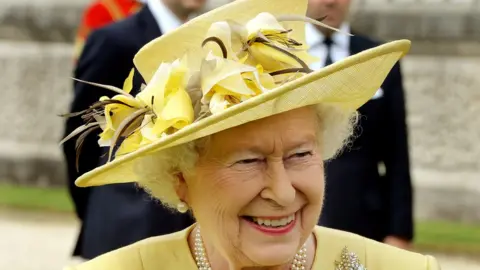 Getty Images The Queen wearing a yellow floral hat