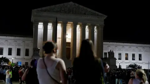 Reuters Protesters react outside the Supreme Court