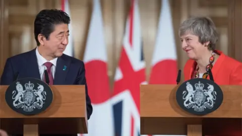 Getty Images Shinzo Abe and Theresa May on Thursday