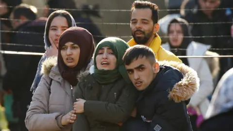 Reuters Migrants walk towards Greek border